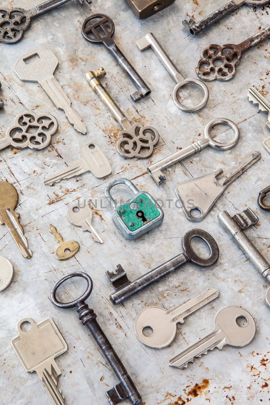 Various key on rusty metal background