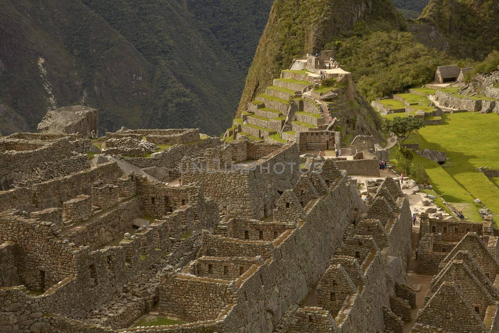 MACHU PICCHU, CUSCO, PERU - NOVEMBER 25, 2011: People Visiting Lost Incan City of Machu Picchu near Cusco in Peru. Peruvian Historical Sanctuary and UNESCO World Heritage Site.