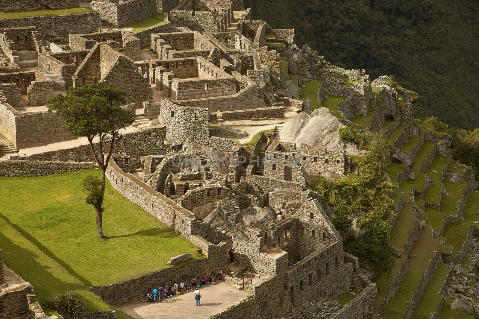 MACHU PICCHU, CUSCO, PERU - NOVEMBER 25, 2011: People Visiting Lost Incan City of Machu Picchu near Cusco in Peru. Peruvian Historical Sanctuary and UNESCO World Heritage Site.