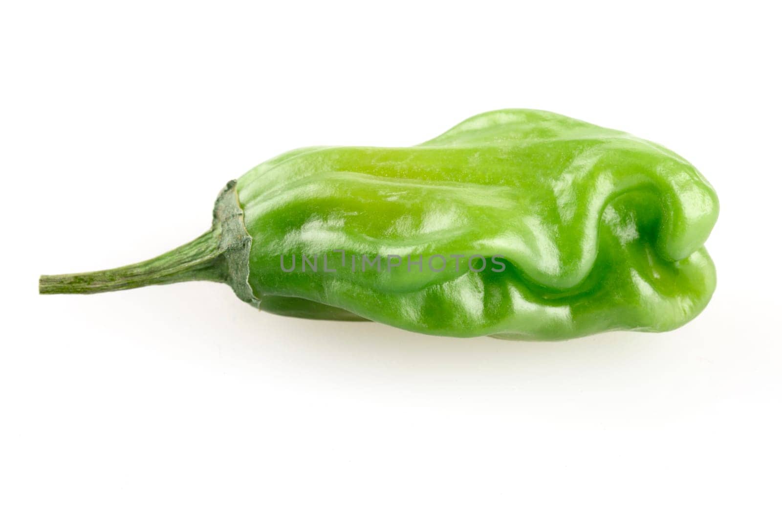 Shishito peppers isolated on a white background with shadow.