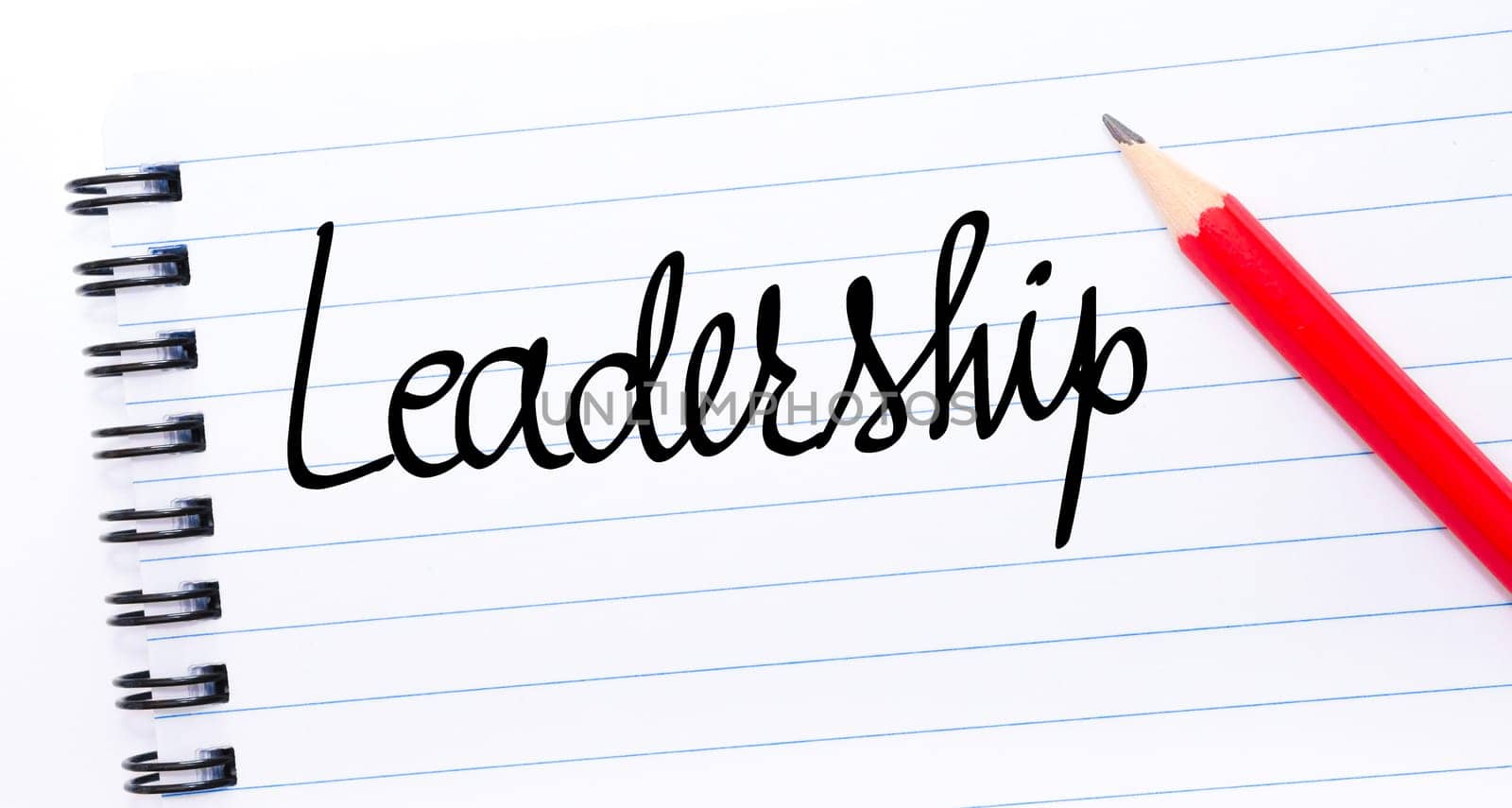 Leadership written on notebook page with red pencil on the right
