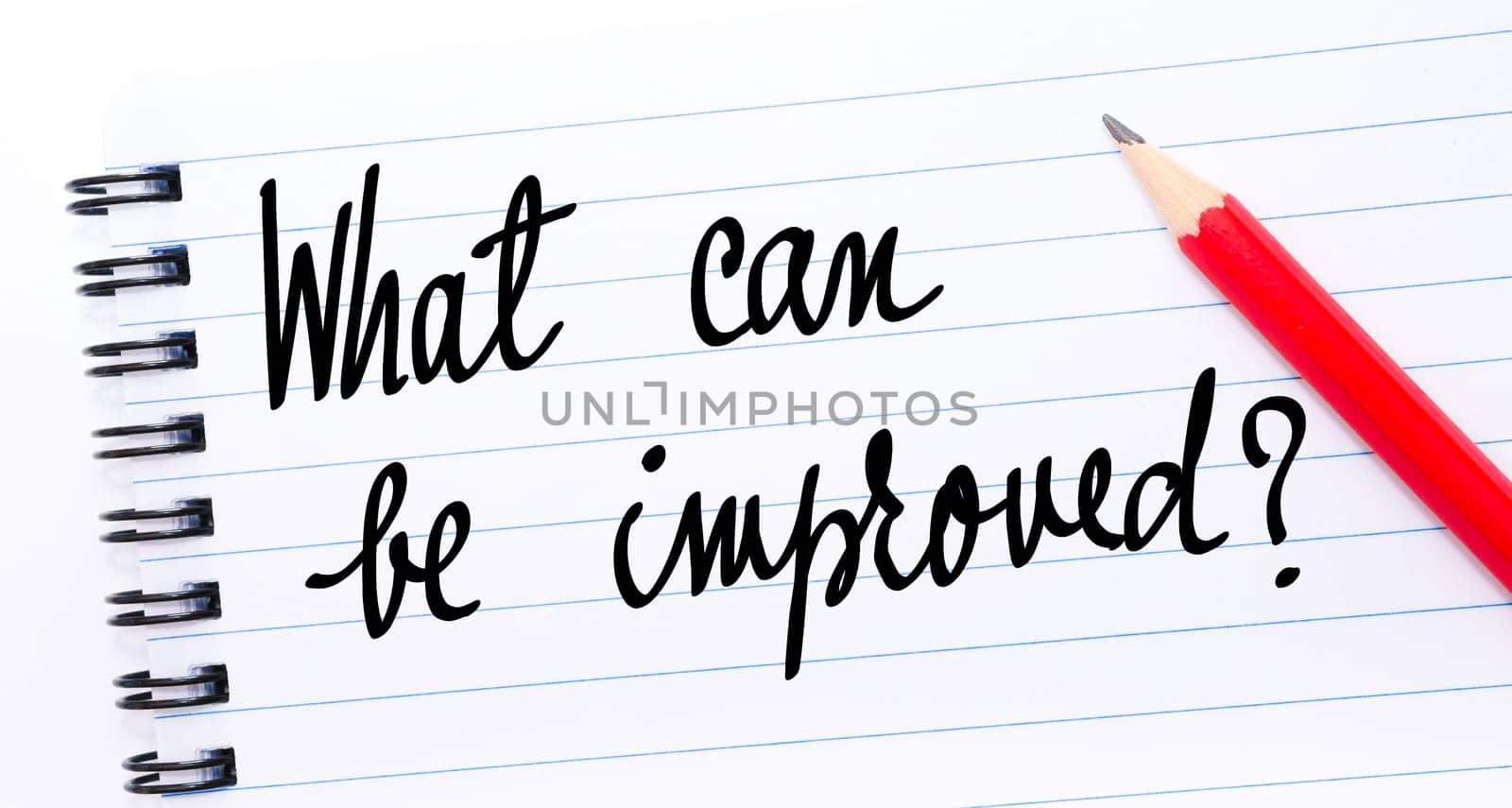 What Can Be Improved ? written on notebook page with red pencil on the right