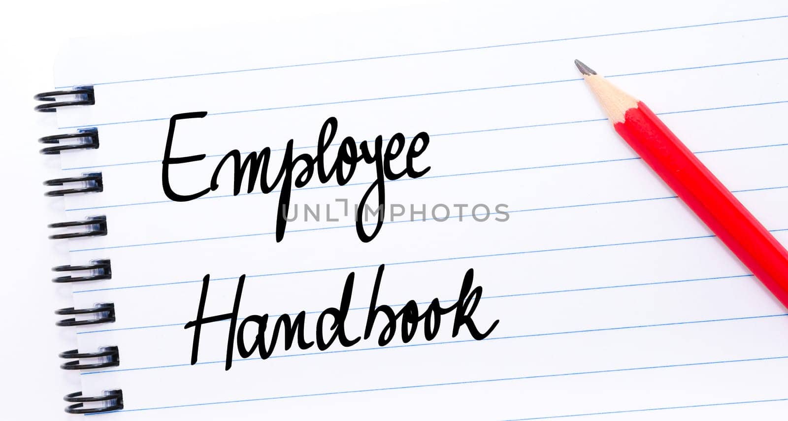 Employee Handbook written on notebook page with red pencil on the right