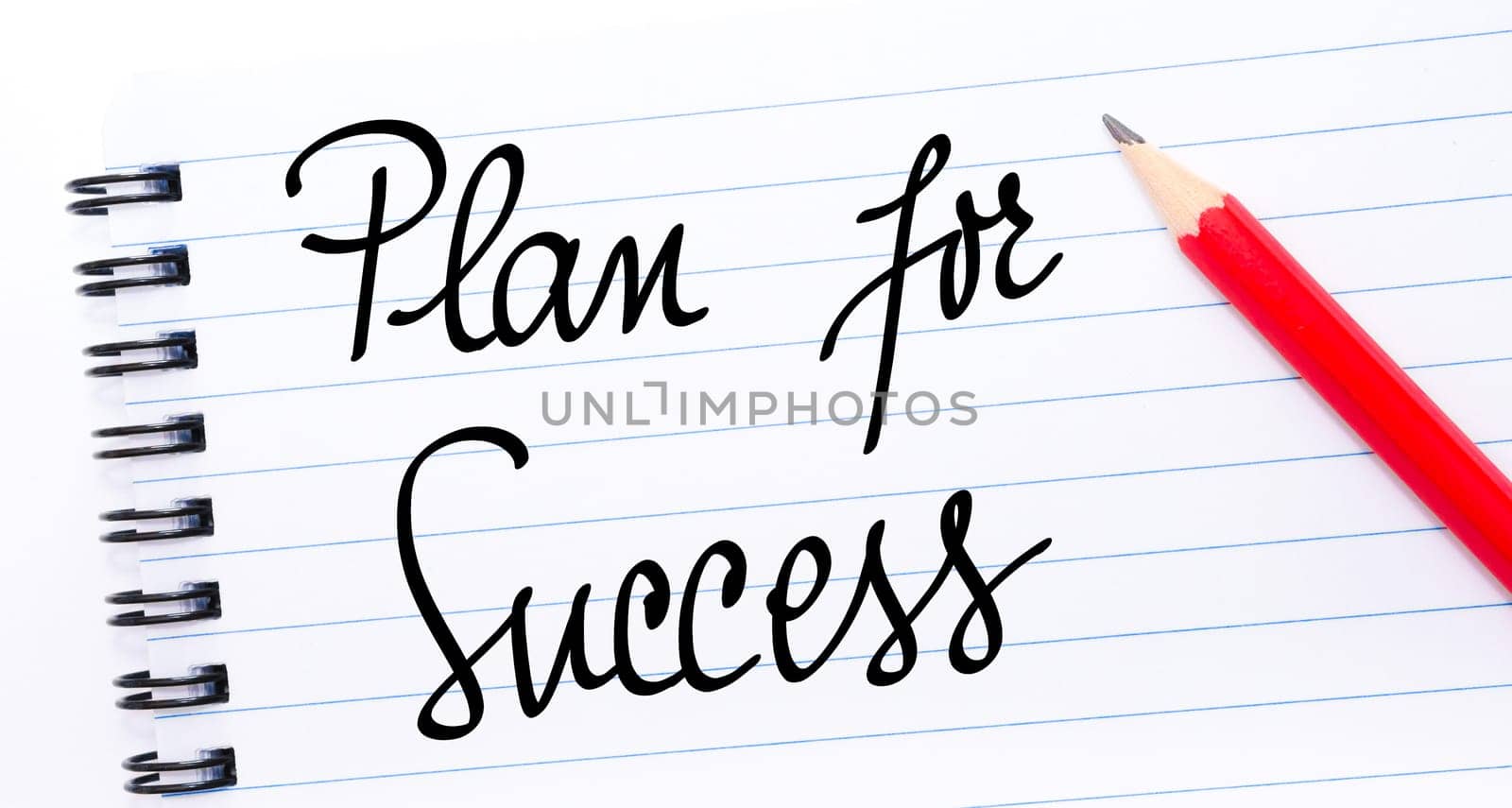 Plan For Success written on notebook page with red pencil on the right