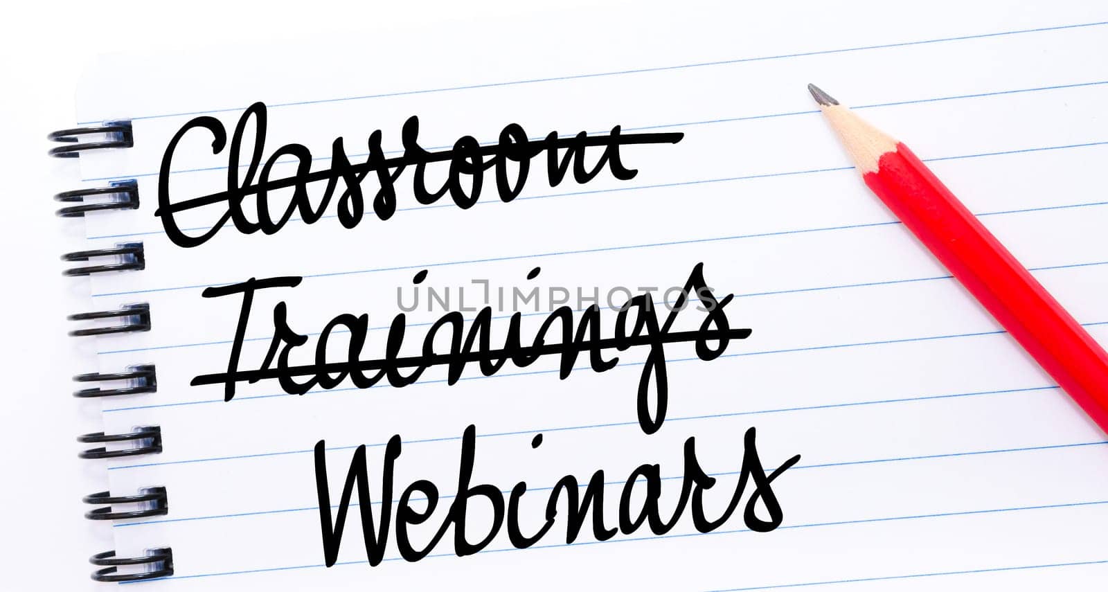 Webinars written on notebook page with red pencil on the right