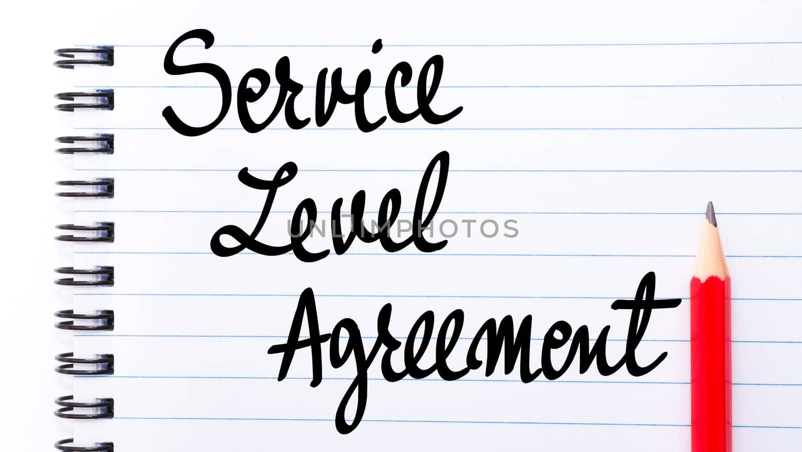 Service Level Agreement written on notebook page with red pencil on the right