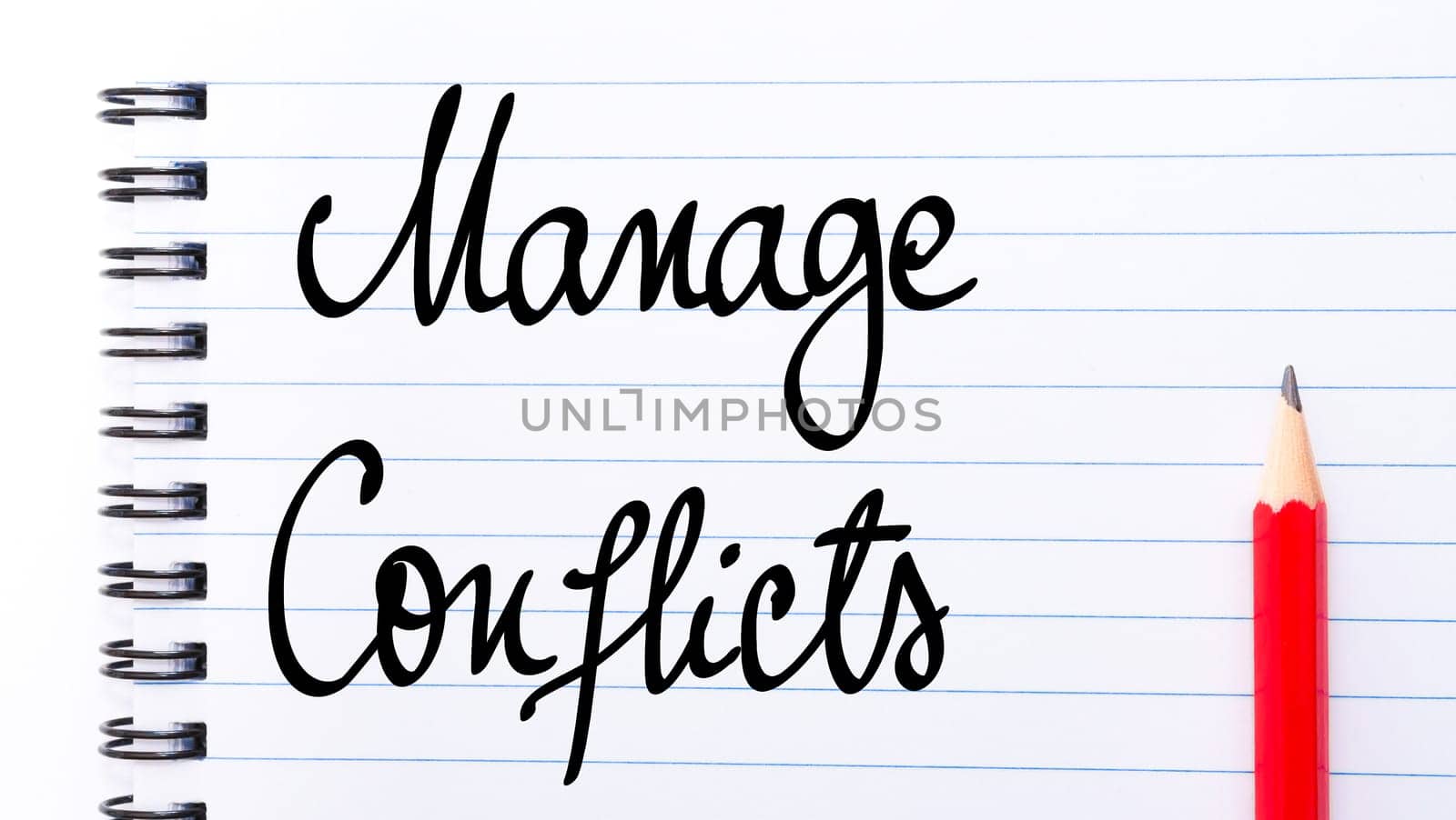 Manage Conflicts written on notebook page with red pencil on the right