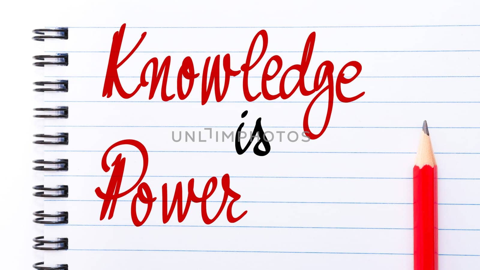 Knowledge is Power written on notebook page with red pencil on the right