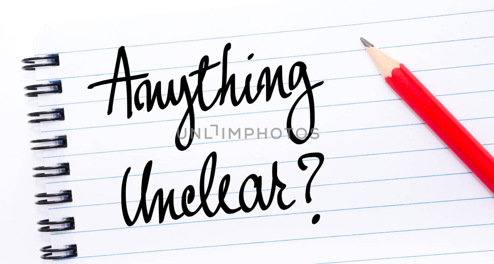 Anything Unclear ? written on notebook page with red pencil on the right