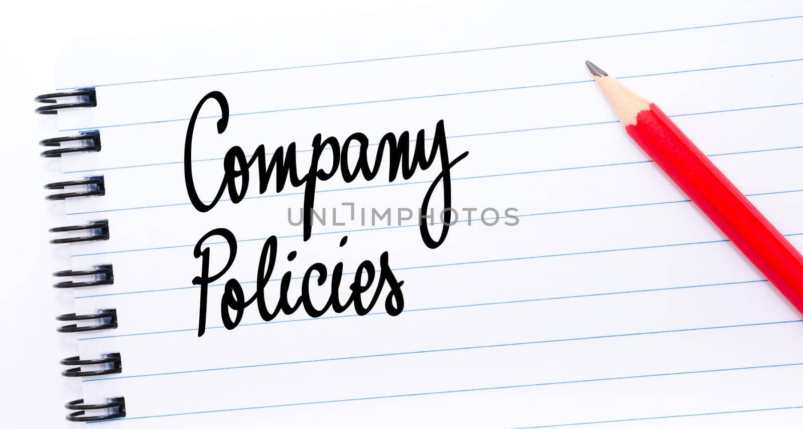 Company Policies written on notebook page with red pencil on the right