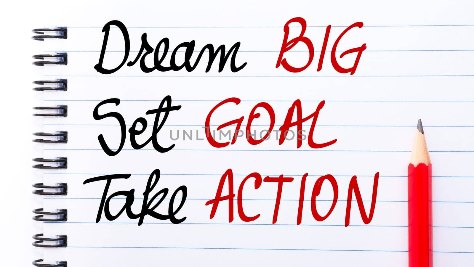 Dream BIG, Set GOAL, Take ACTION written on notebook page with red pencil on the right