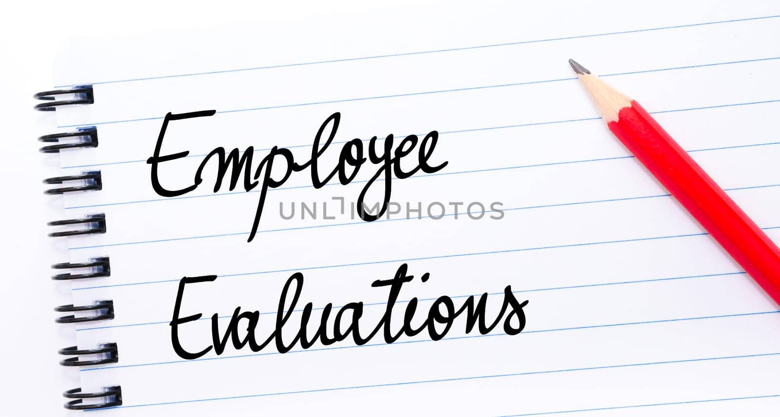 Employee Evaluations written on notebook page with red pencil on the right