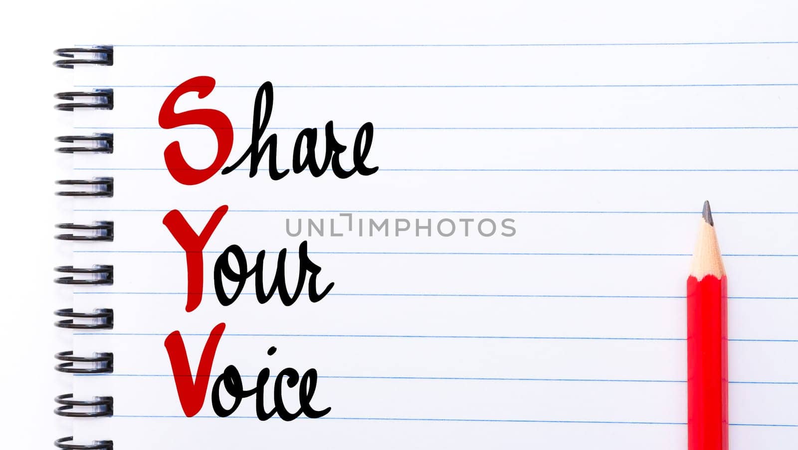 SYV Share Your Voice written on notebook page with red pencil on the right