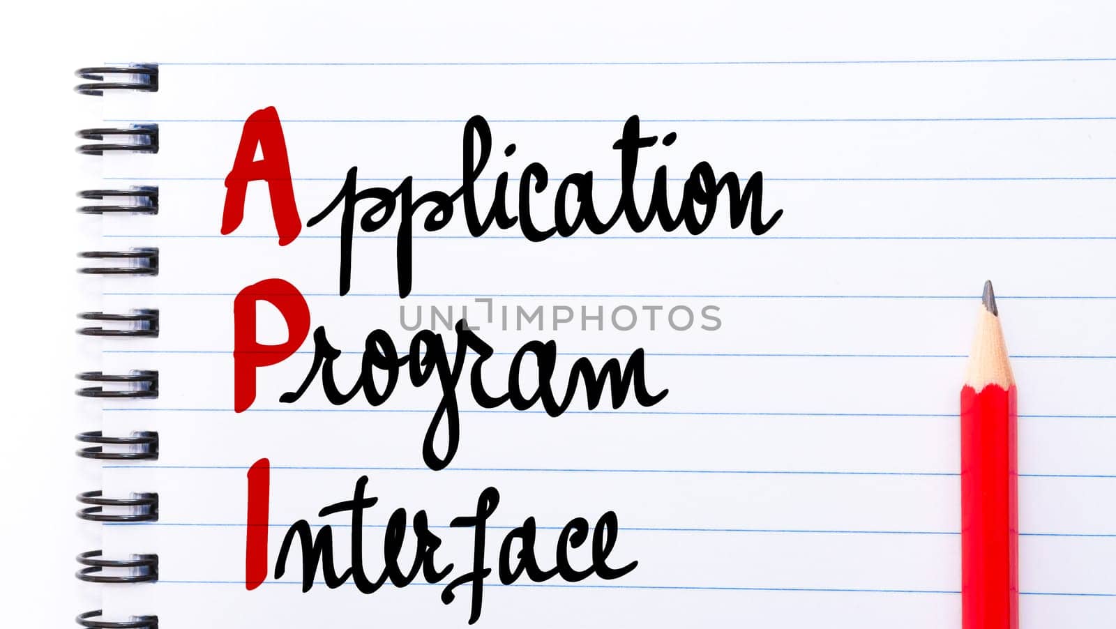 API Application Program Interface written on notebook page with red pencil on the right