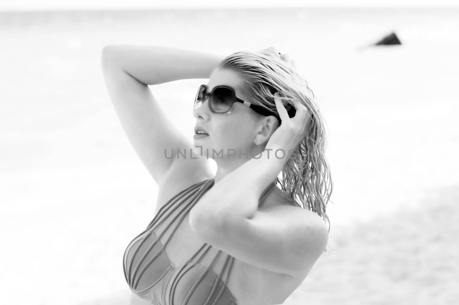 black-and-white portrait of the beautiful woman with wet hair