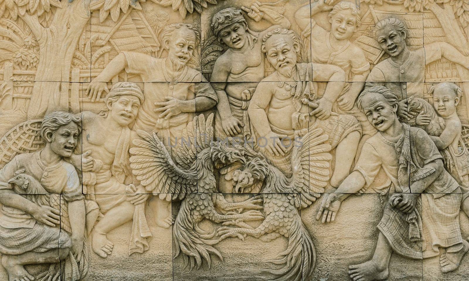 Stone carving of traditional Thai rural cockfighting, Thailand