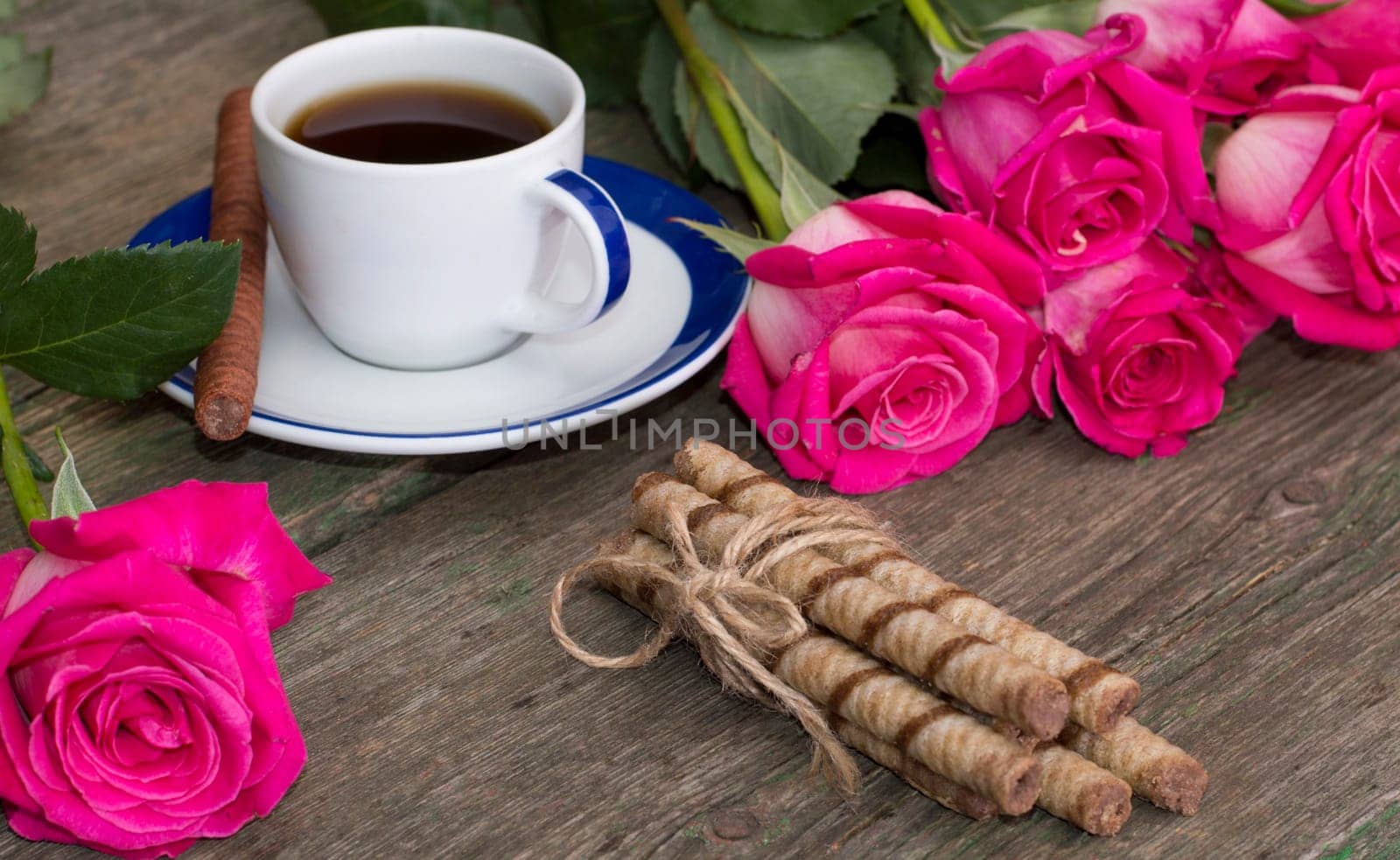 still life bouquet of roses, cup of black coffee, linking of cookies and one rose, subject beautiful flowers and drinks, greeting card