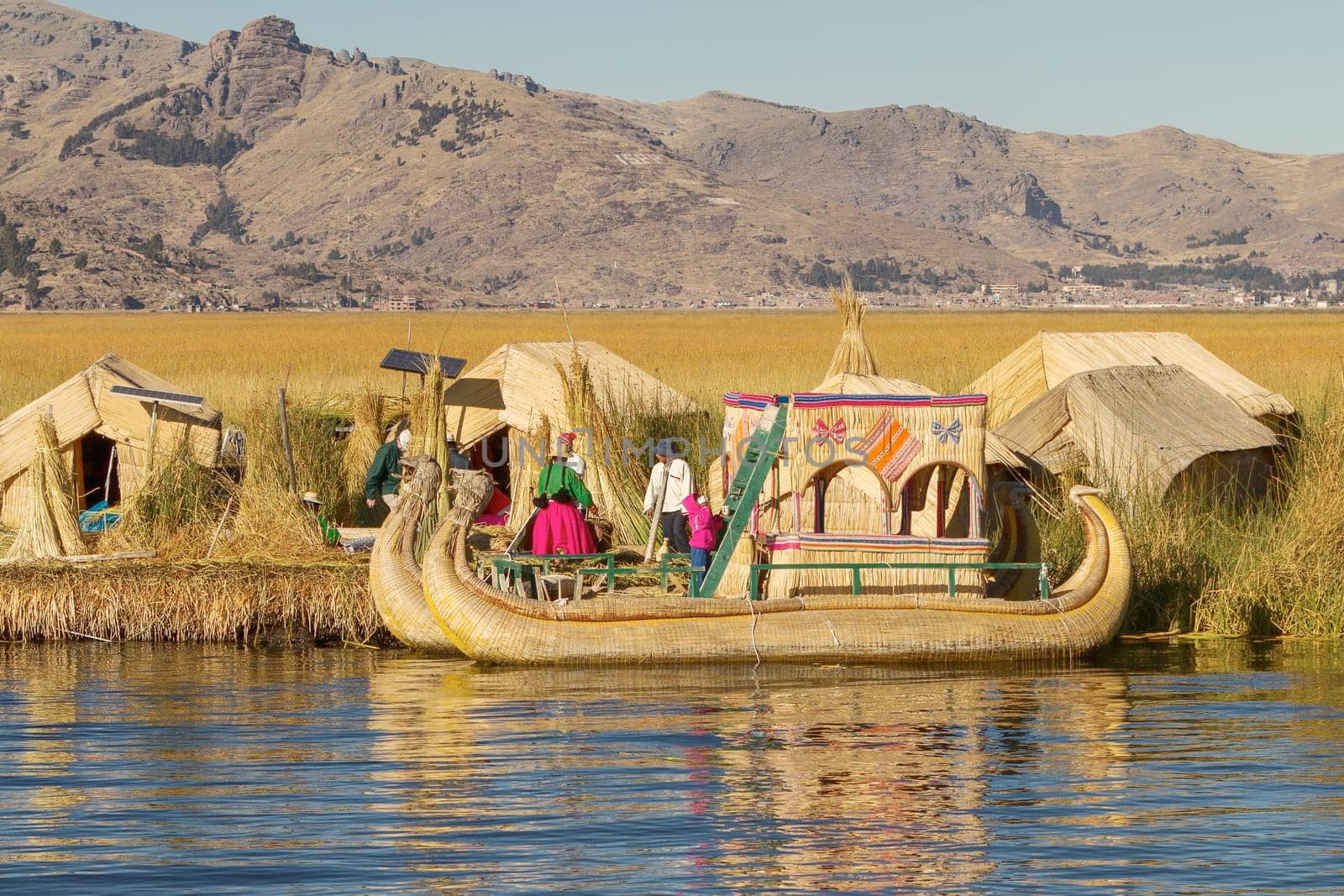 UROS, PERU - JULY 29 2012: Family living on floating reed islands at Lake Titicaca Peru Bolivia.