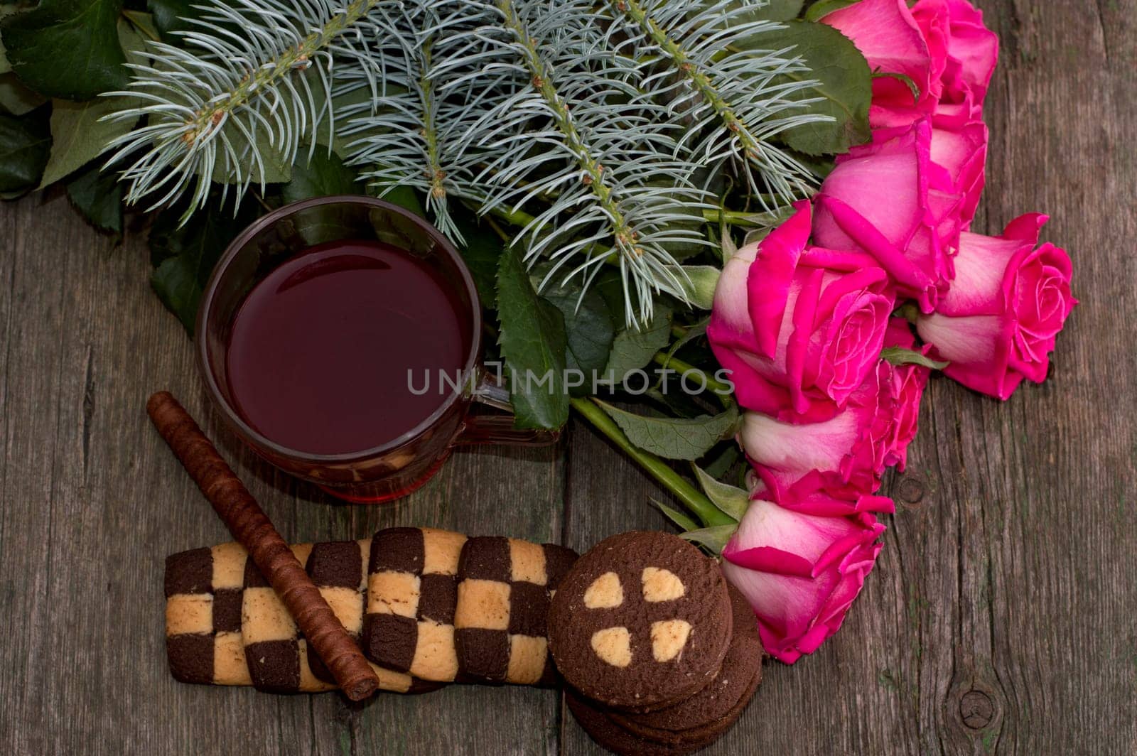 fir-tree branch, tea, roses and linking of cookies, subject holidays, food and drinks