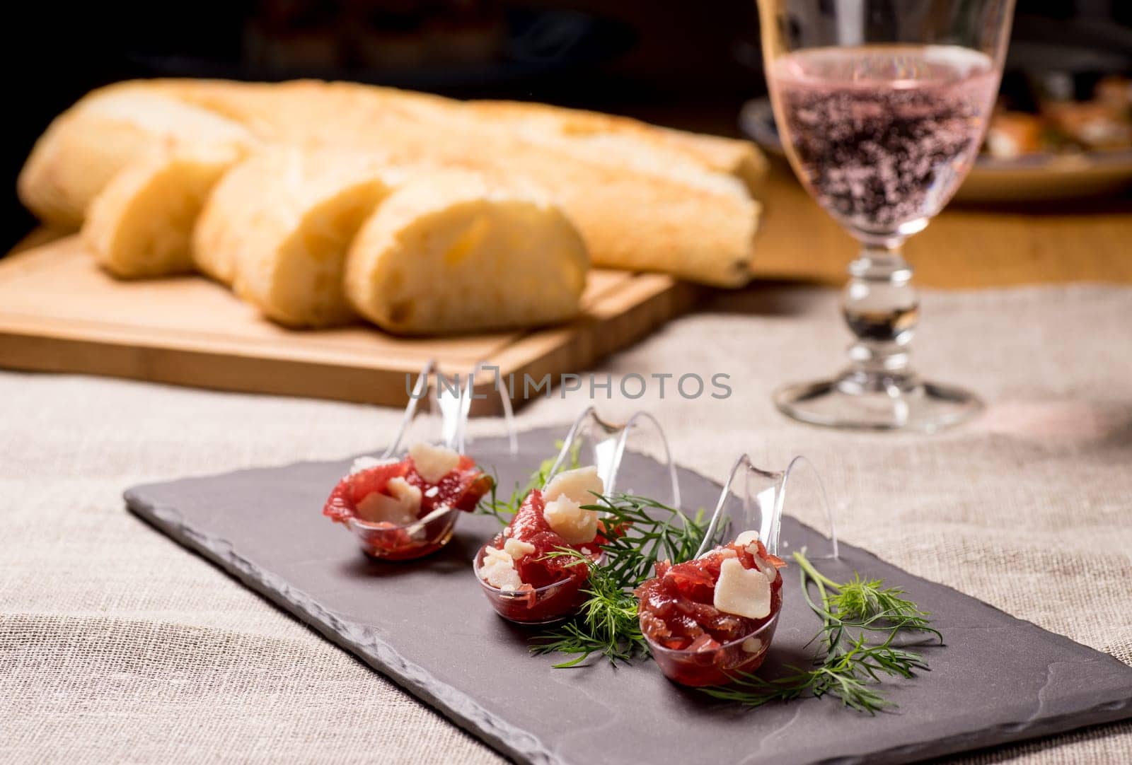 Appetizer with meat, Carpaccio and parmesan served on a Spoon