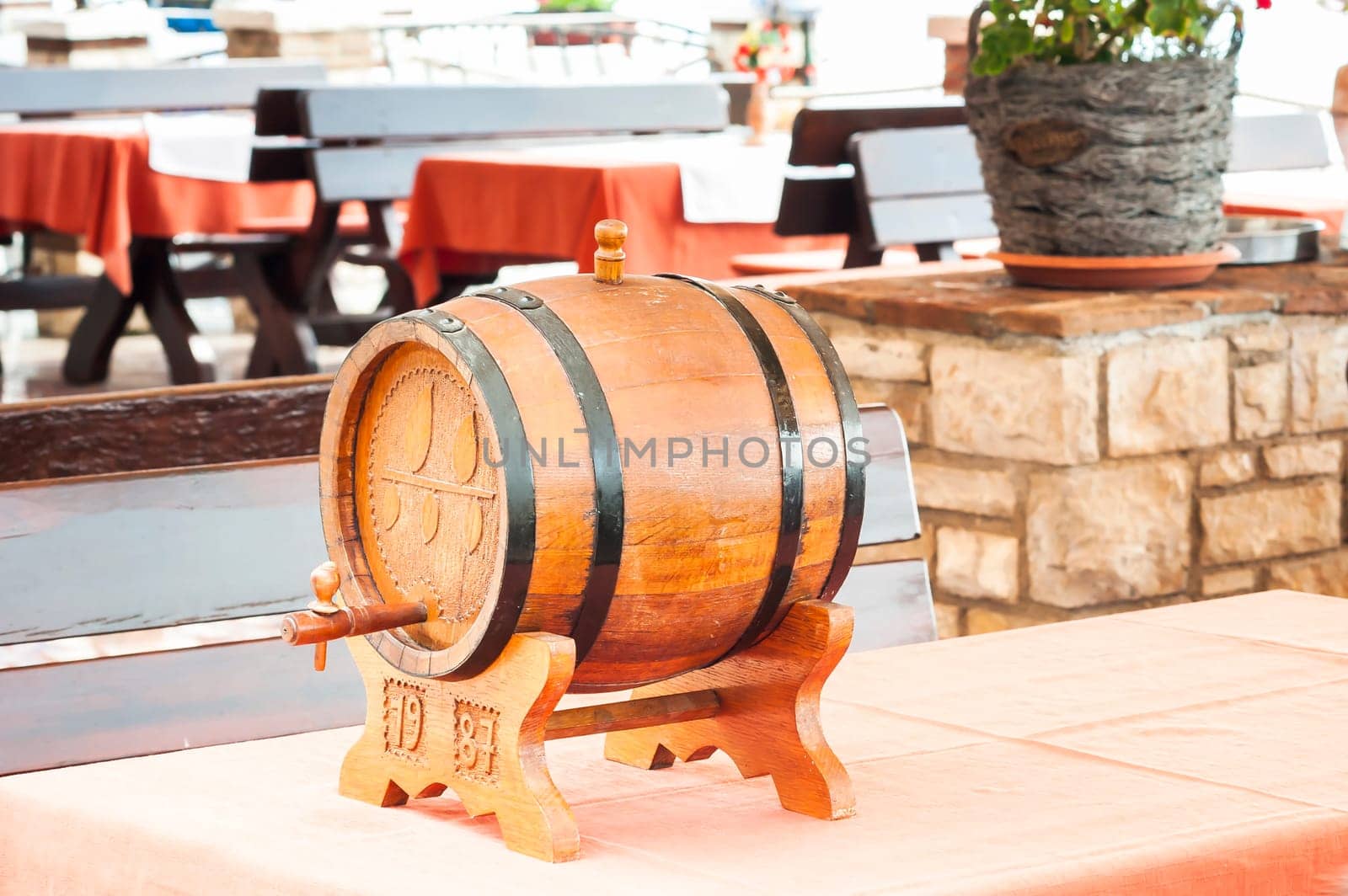 Small barrel of wine on table of restaurant