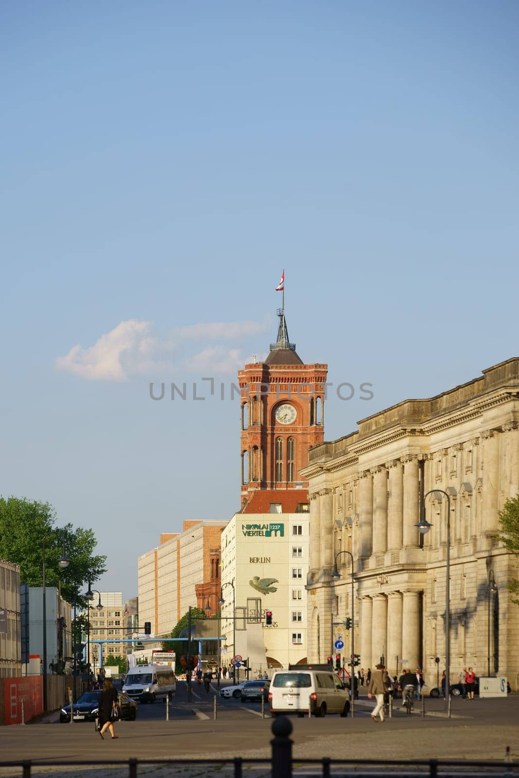 Berlin,Germany - May 10,2016: Pedestrians and road traffic on Spandauer Straße in front of the Red City Hall on May 10,2016 in Berlin.