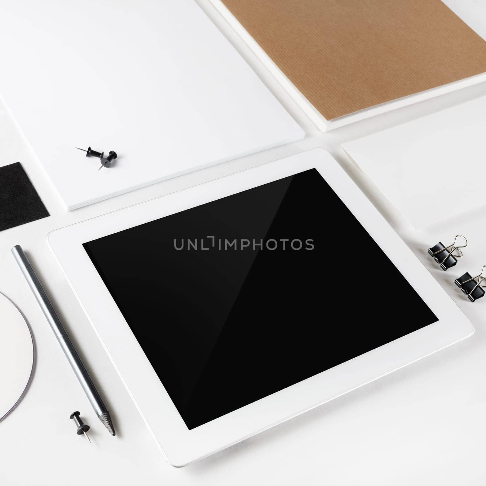 Blank tablet pc and blank stationery on white paper background. Corporate identity template. Mock-up for branding identity for design presentations and portfolios.