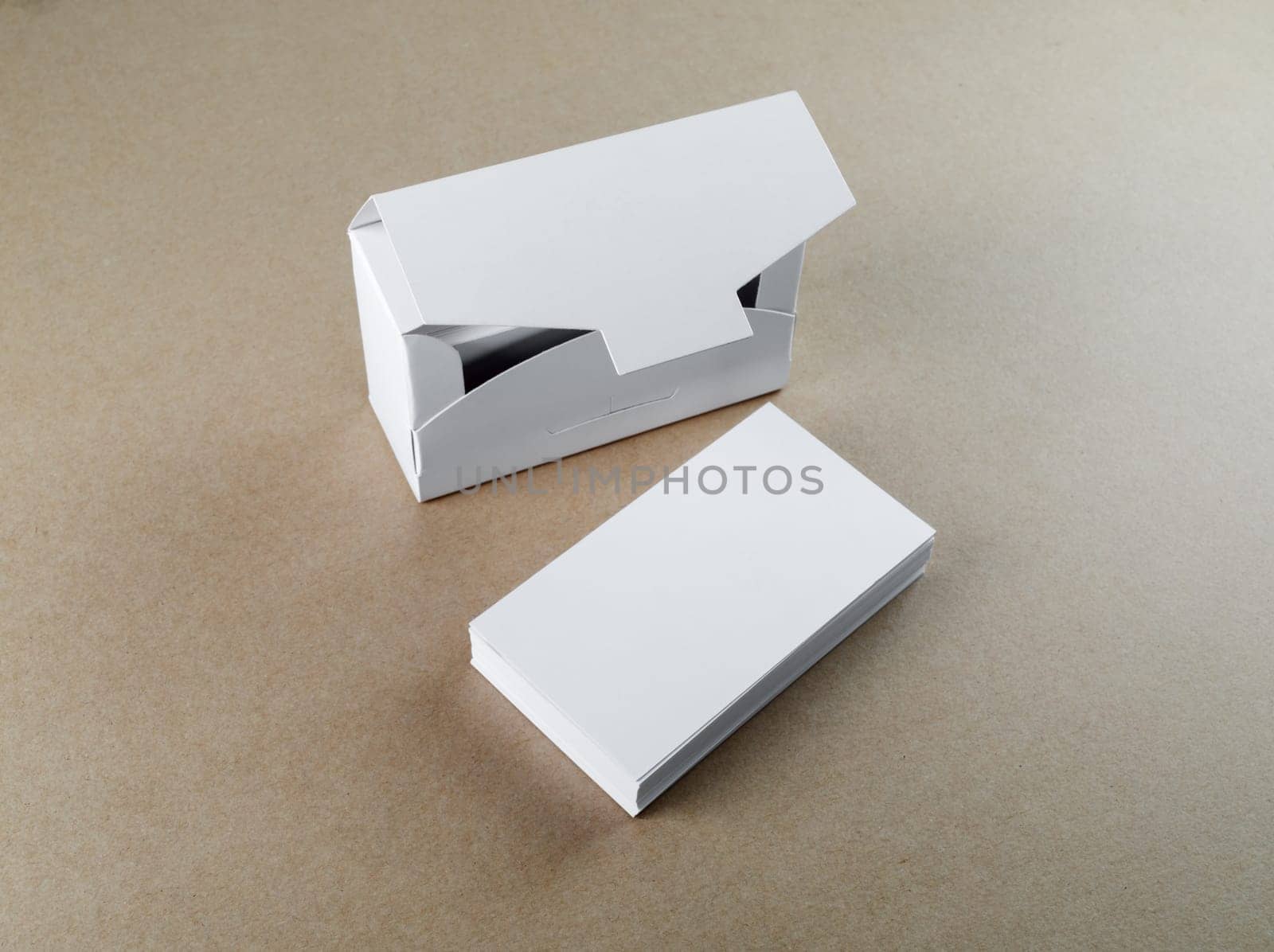 Blank business cards and a box for them on the table. Template for branding identity.
