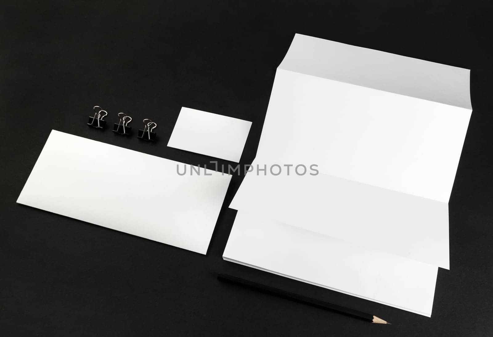 Corporate identity template on black background. Photo of blank stationery. For design presentations and portfolios. Mock-up for branding identity.
