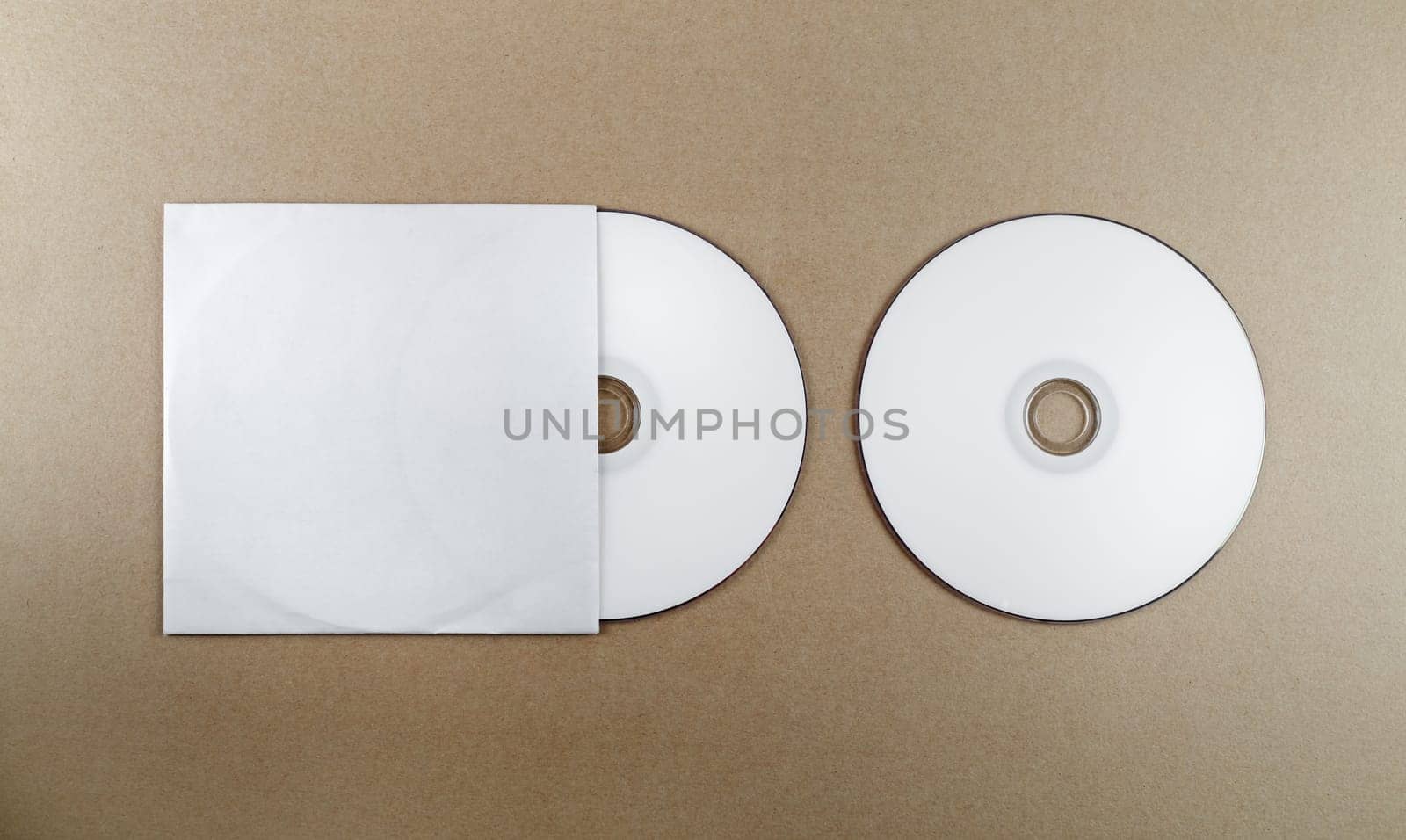 Blank compact disk on a table. Template for branding identity for designers. Top view.