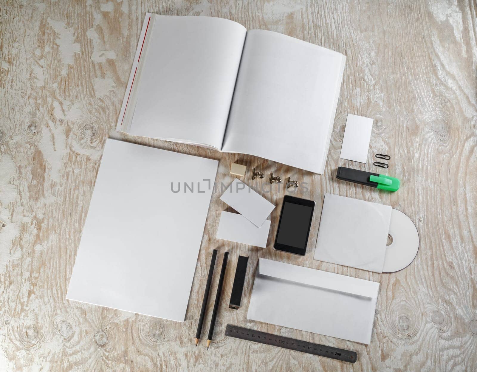 Blank corporate identity template on light wooden background. Mock-up for graphic designers portfolios.