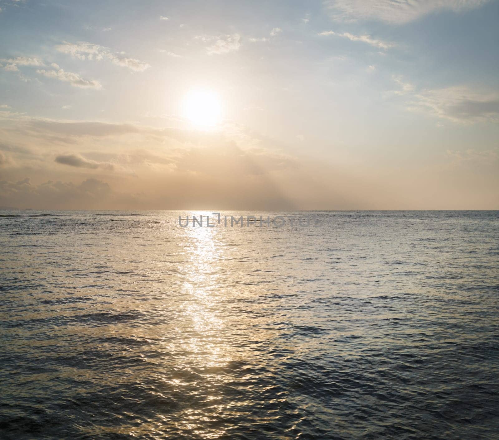 Sunrise over the sea. Sun reflection in sea.