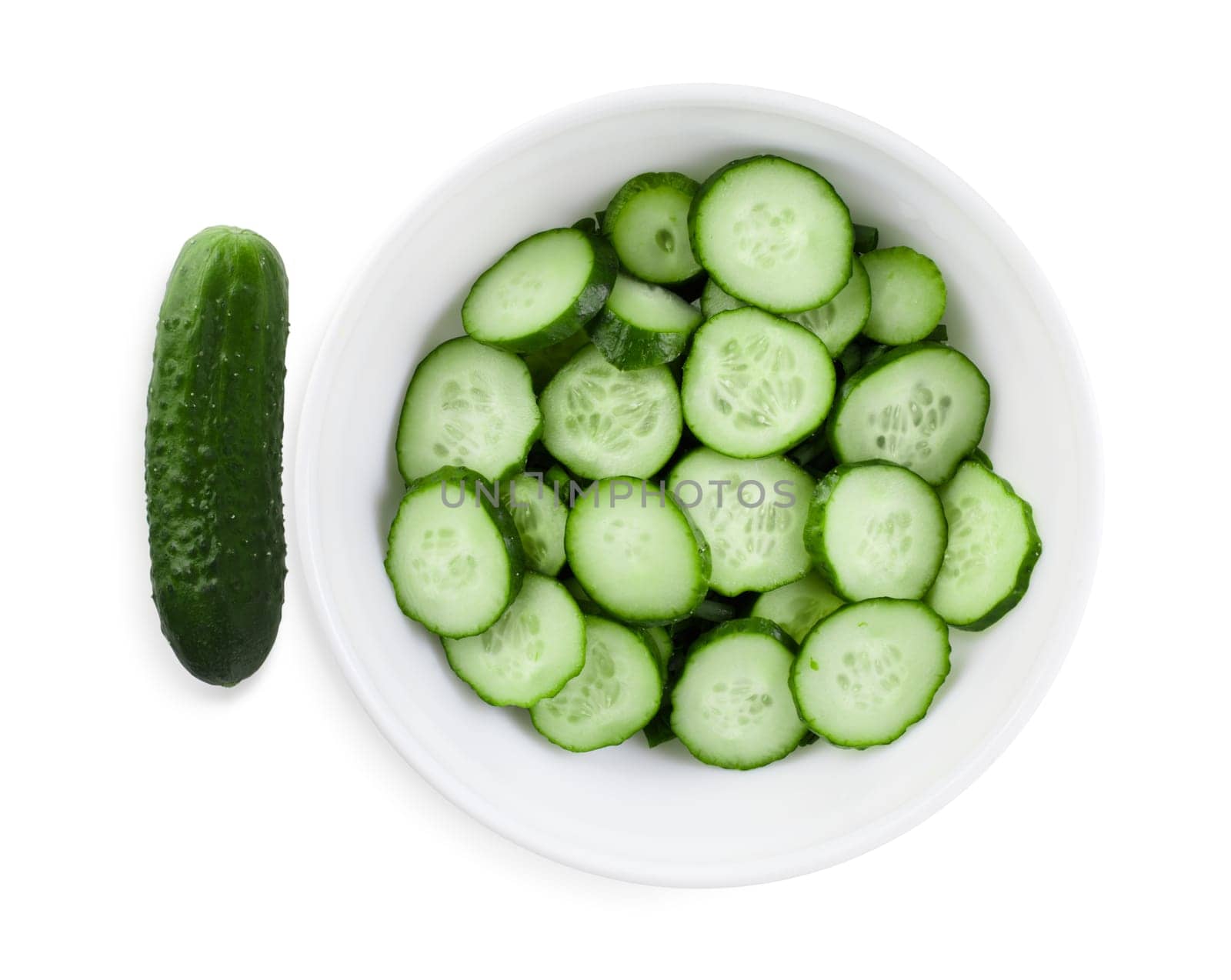 Fresh cucumbers, cut into slices on a white plate. Clipping path.