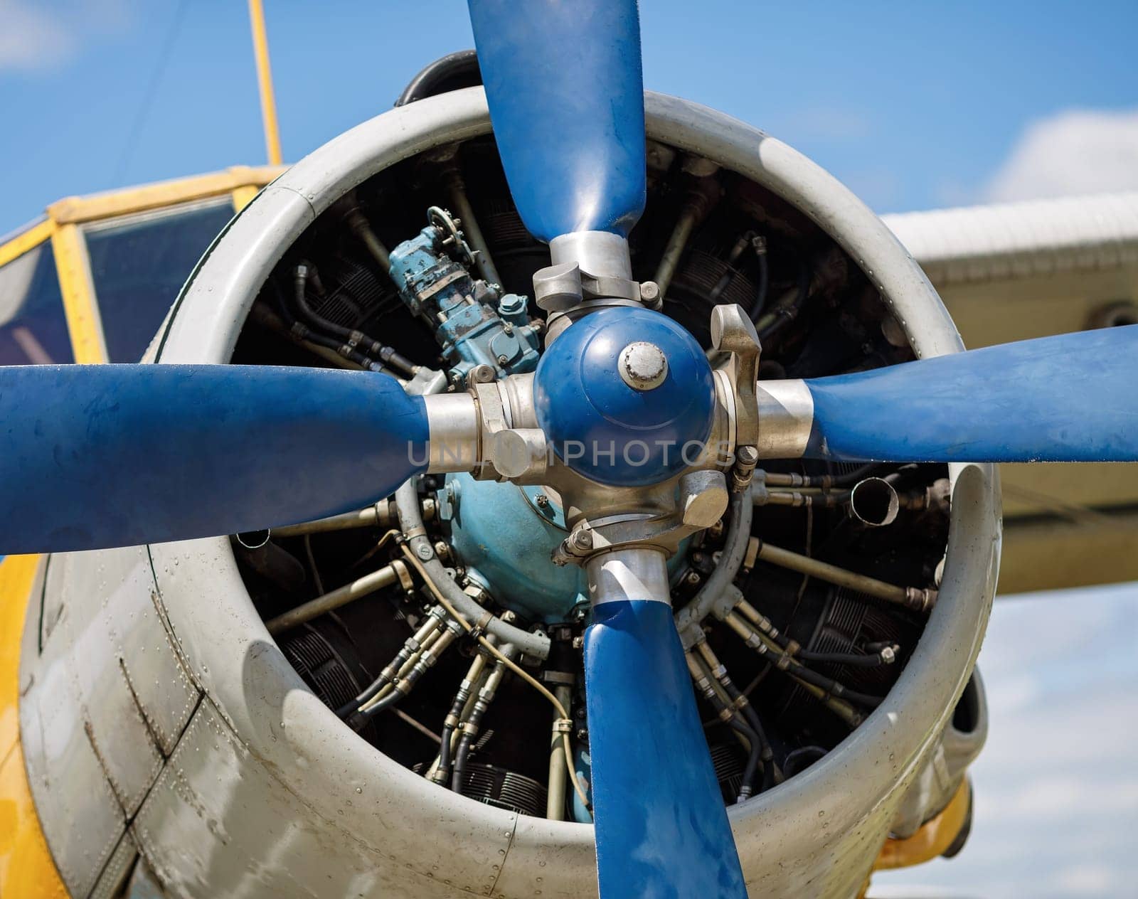 Propeller and airplane engine close-up. Shallow depth of field. Selective focus on propeller.