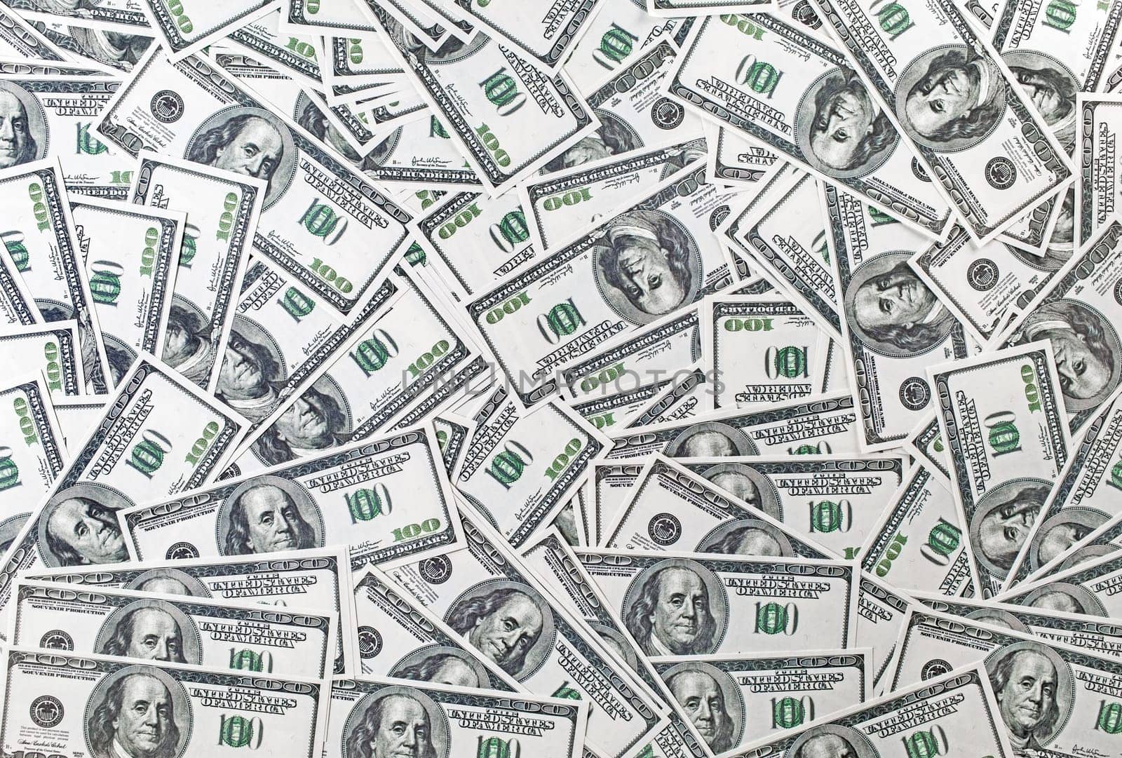 Background from a variety of one hundred dollar bills. Many dollars. Money background. Fake money.