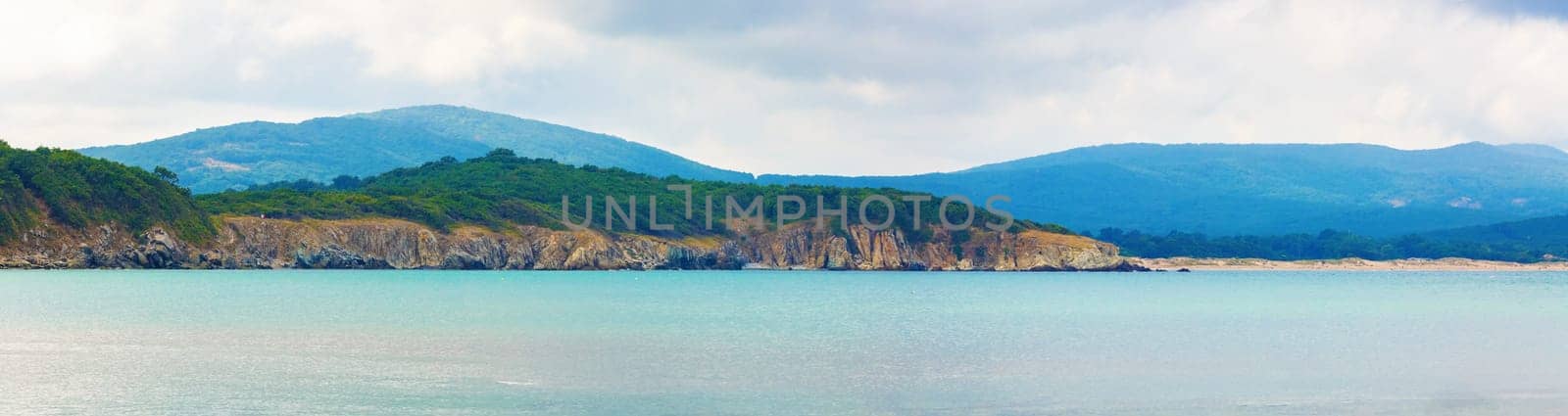 Seascape and mountains. Panoramic shot.