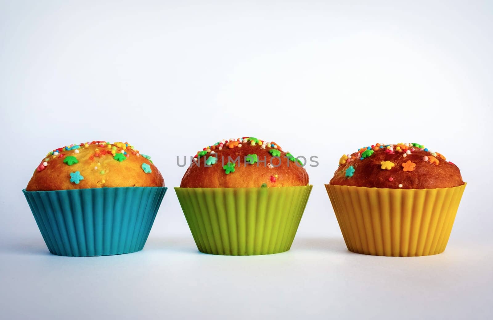 Appetizing delicious homemade cupcakes. Three delicious sweet muffins. Space for text.