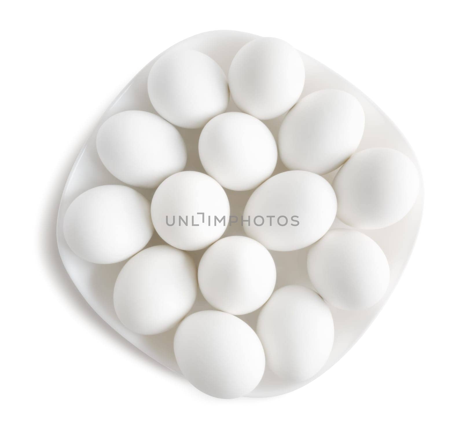 White eggs on a white plate . Clipping path.