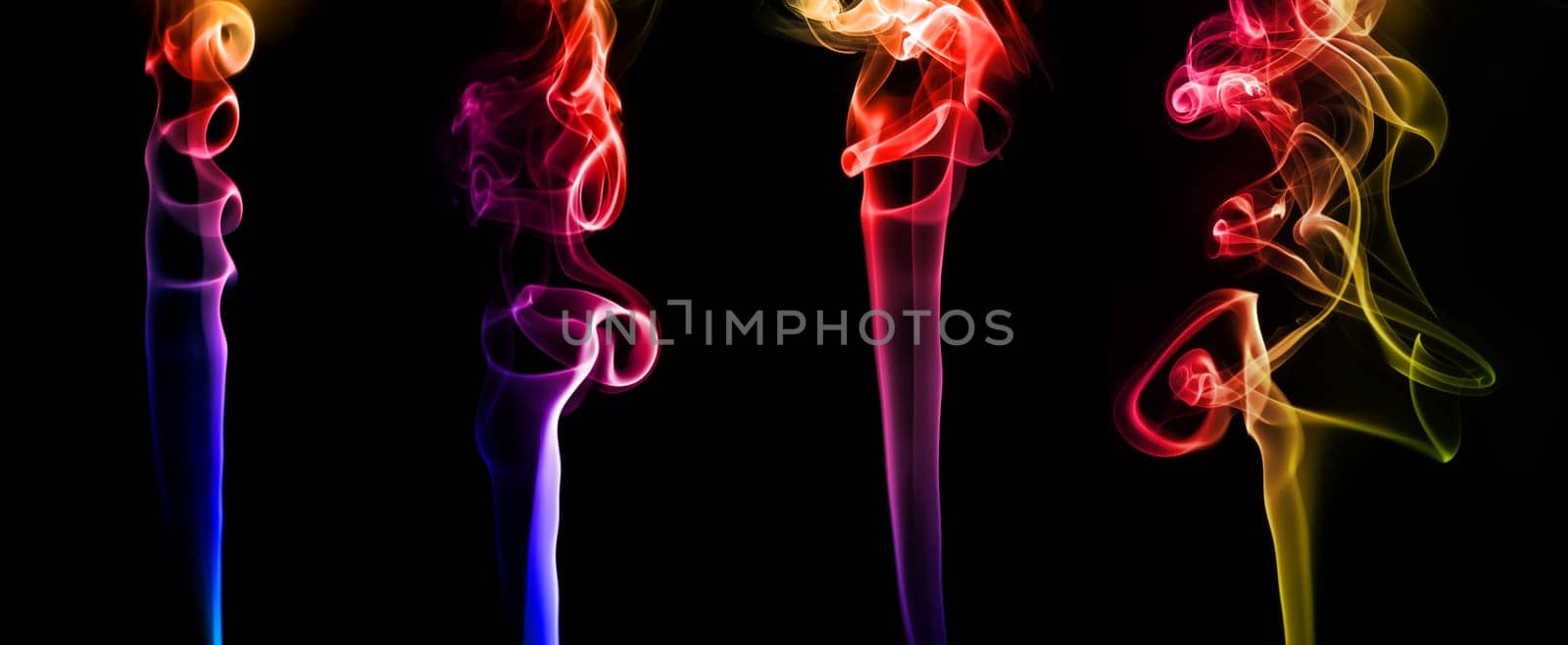 Set of abstract bright colored smoke on a dark background
