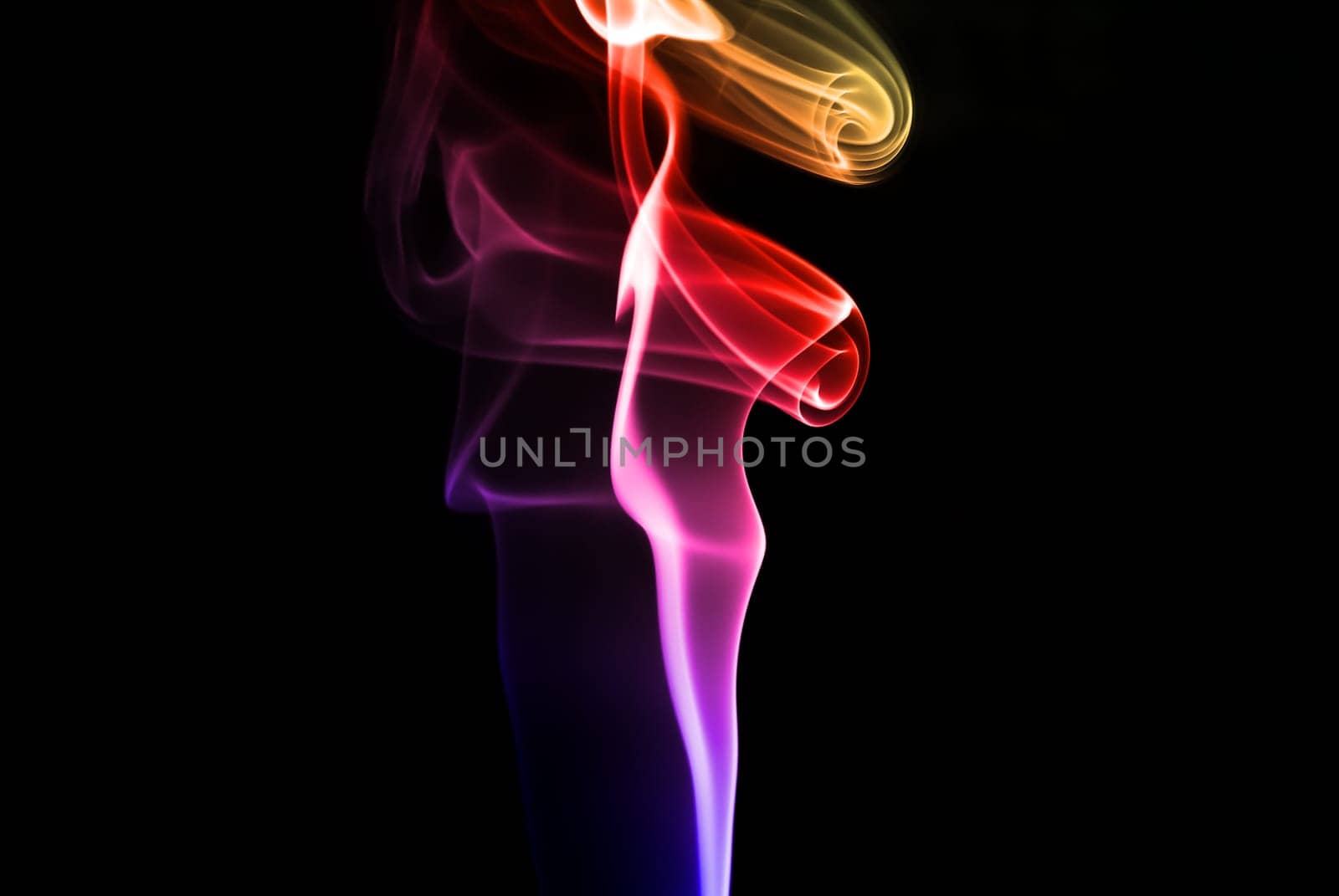 Abstract beautiful colorful smoke on black background.
