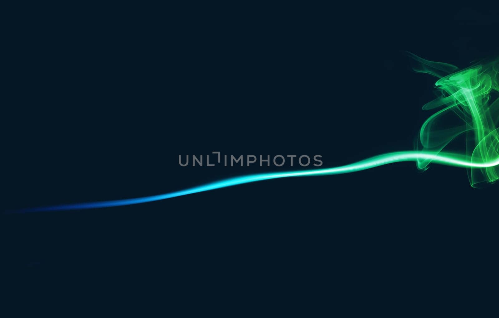 Abstract bright colored smoke on a dark background.