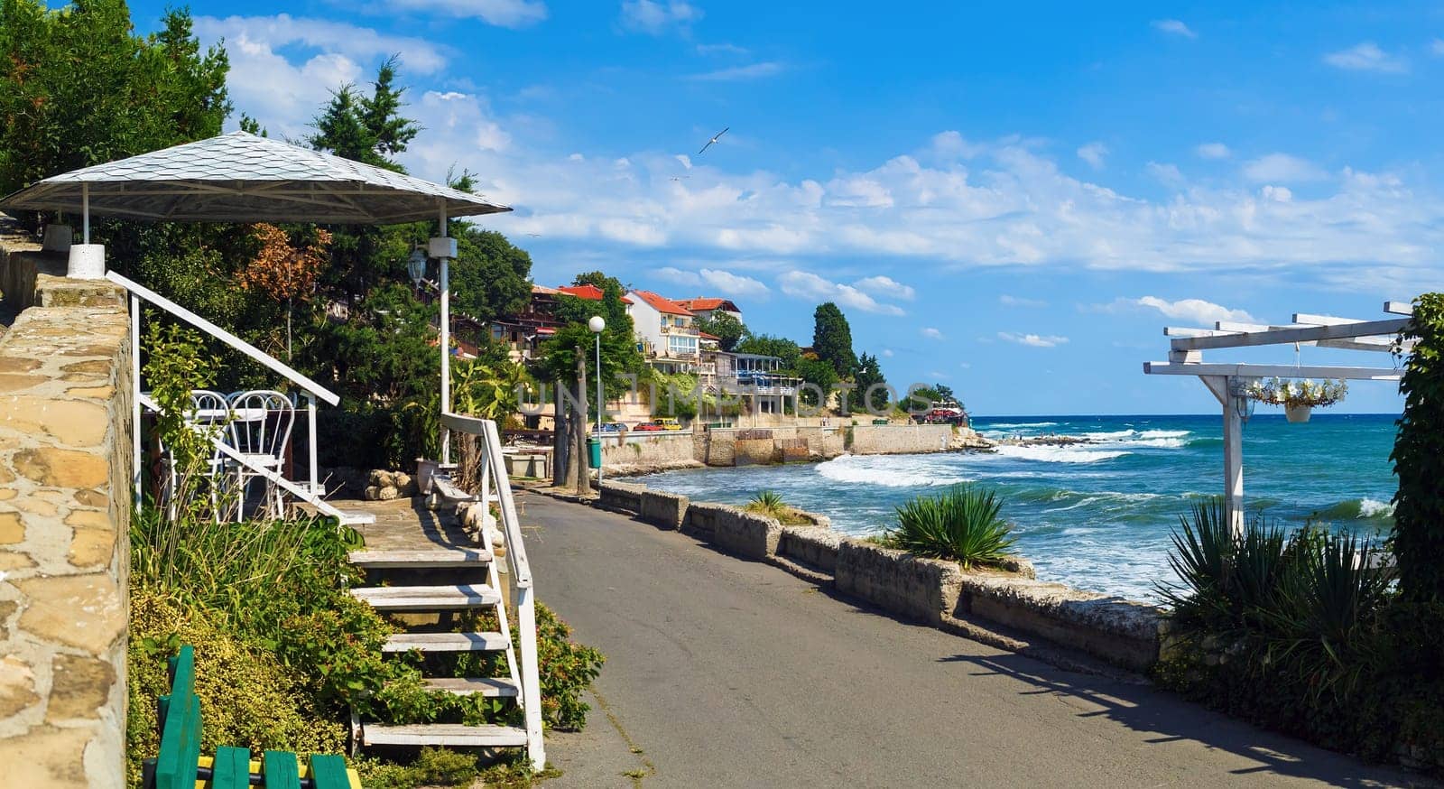 Coastline and sidewalk along the promenade in the old town of Nessebar, Bulgaria. Bulgarian Black Sea coast. UNESCO World Heritage Site.