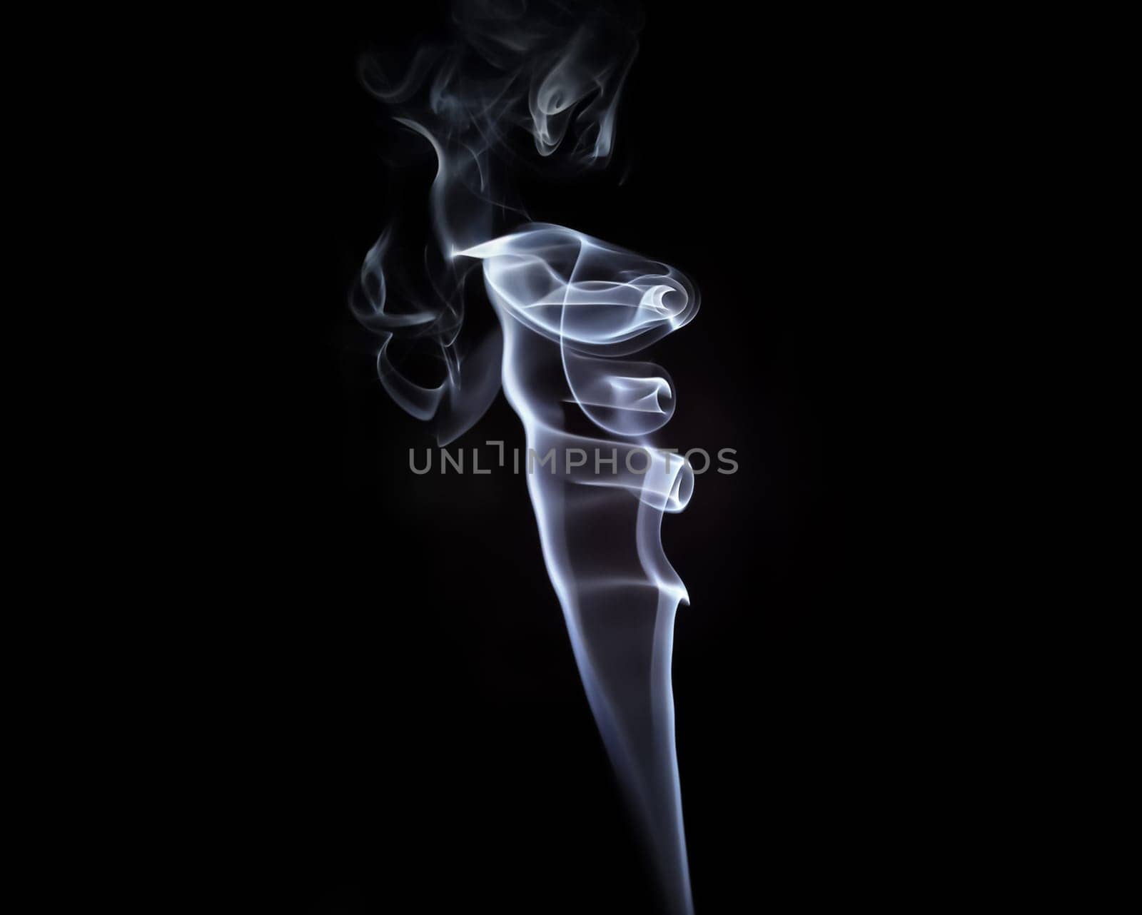 Abstract swirls of smoke on a black background.