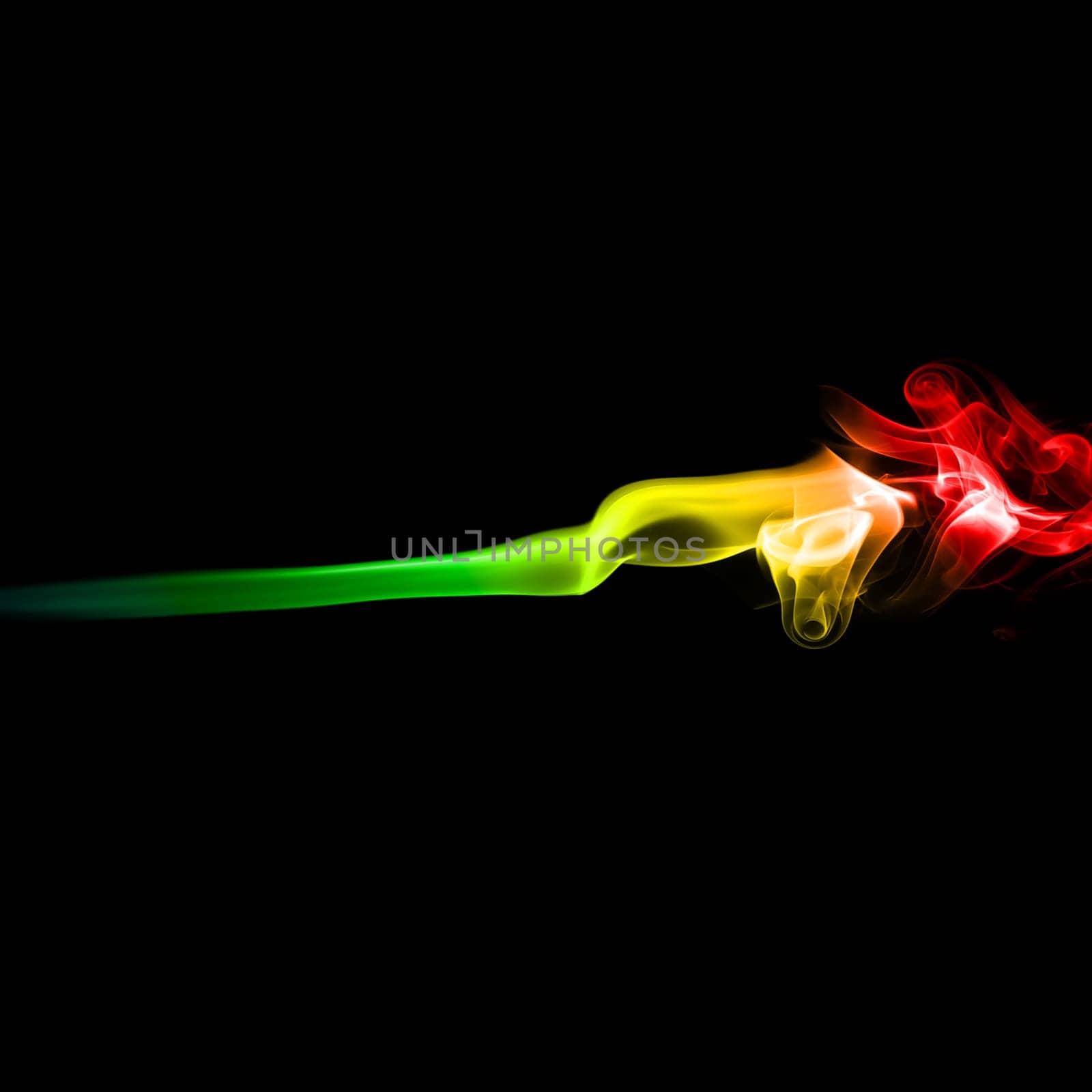 Abstract bright colored smoke on a dark background.