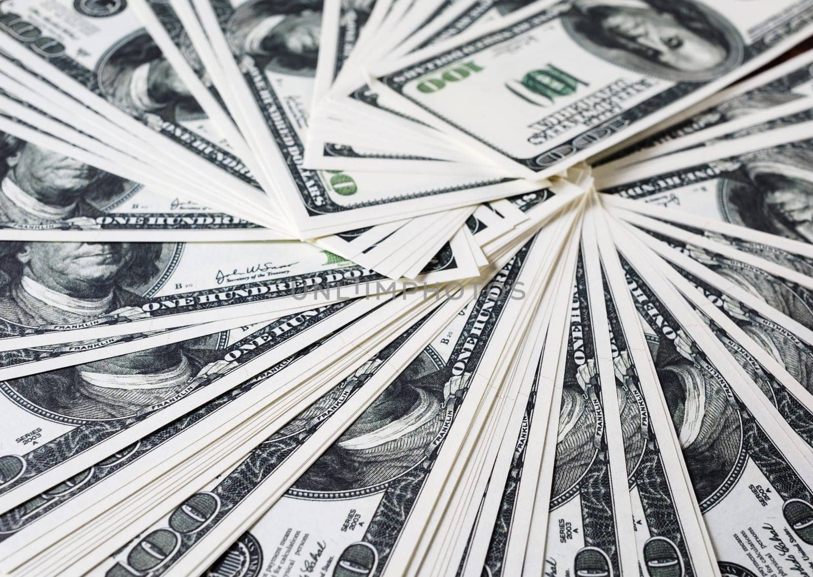 Money as background. One hundred dollars heap. Selective focus.