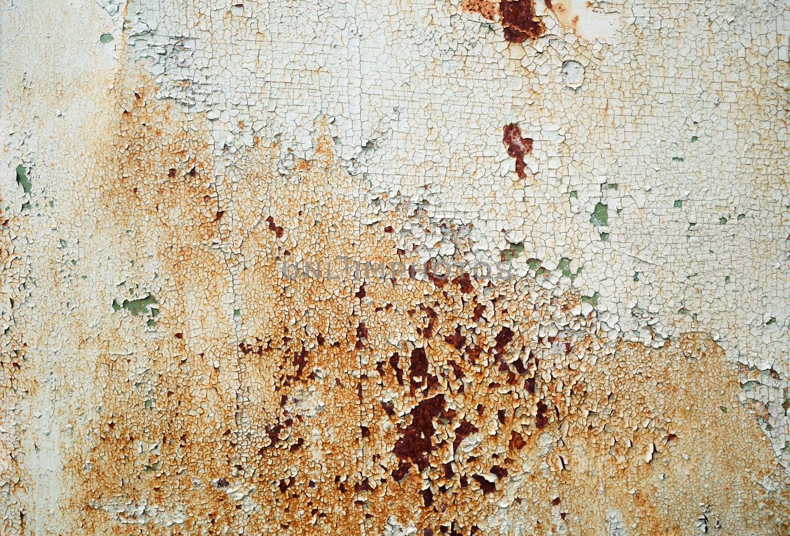 Abstract vintage texture. Old peeling paint with cracks and rust spots. Grunge background.