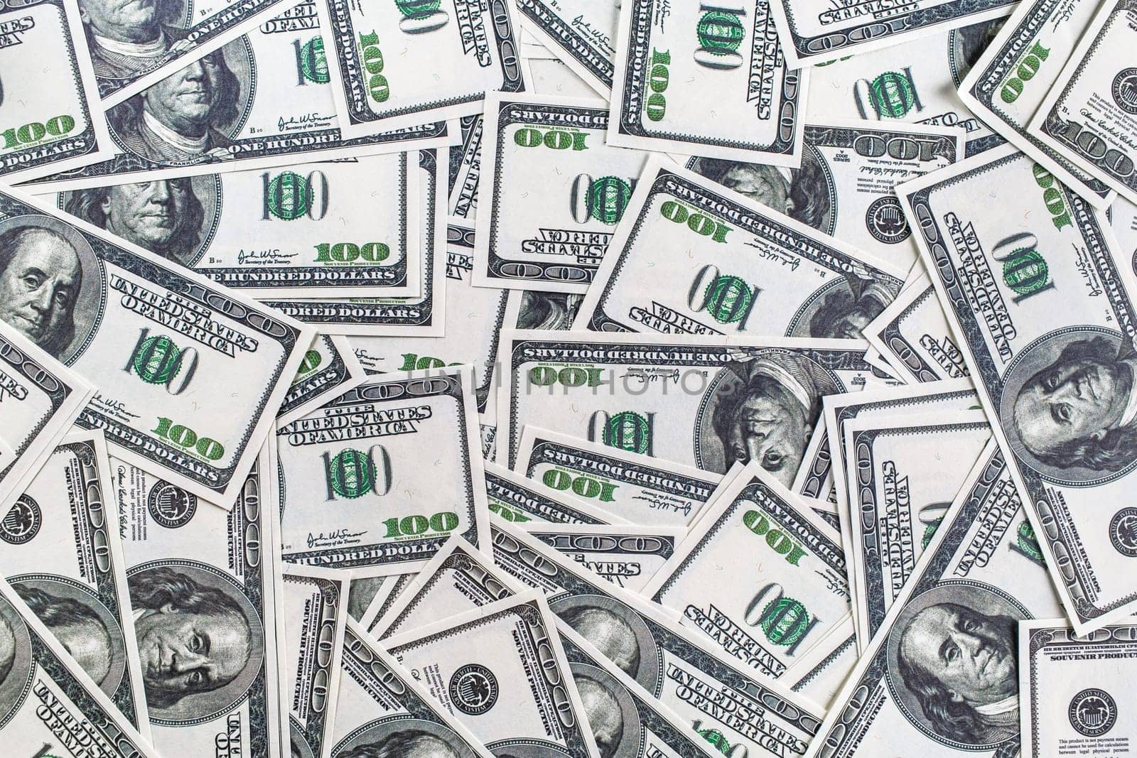 Fake money background. Background from a variety of one hundred dollar bills.