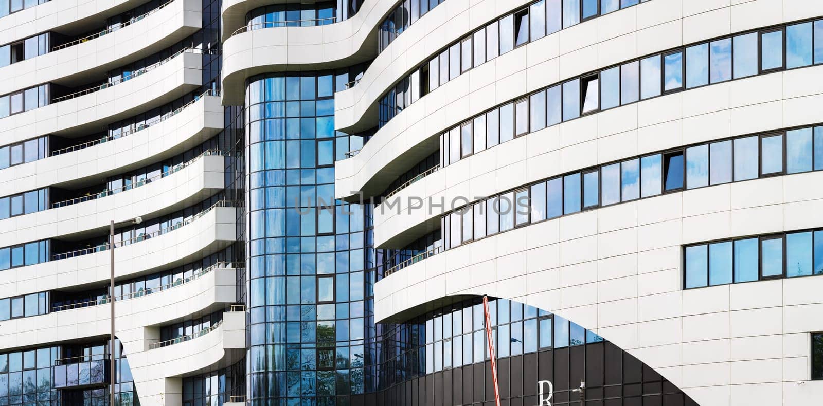 MINSK, BELARUS - MAY 03, 2016: Renaissance Minsk Hotel - this is the first hotel of the well-known international hotel chain Marriott in Belarus. Close-up of modern architecture. Panoramic shot.