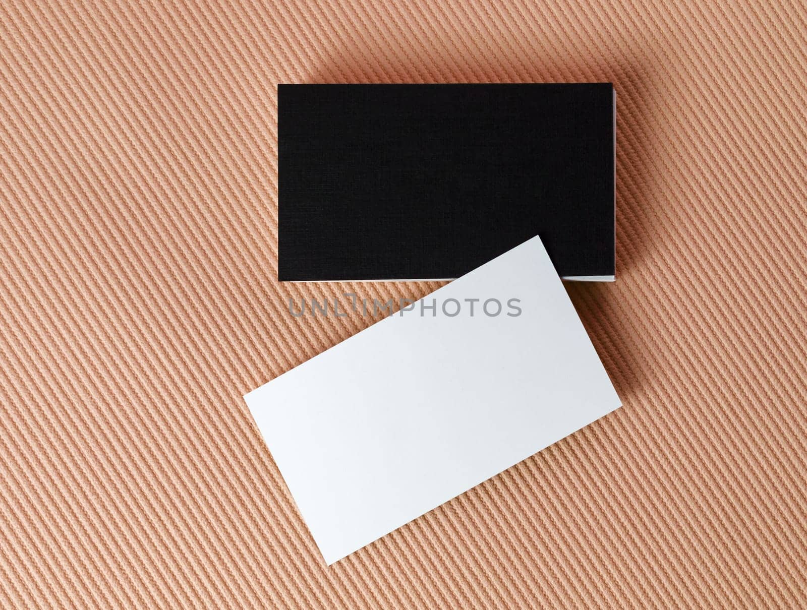 Black and white business cards on color background. Mock-up for branding identity. Isolated with clipping path. Top view.