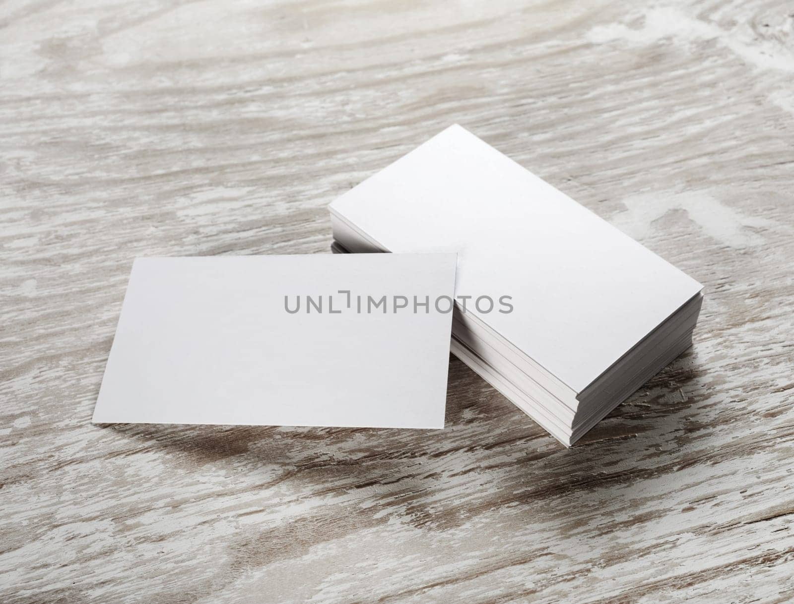 Blank business cards on wooden background. Template for branding identity.